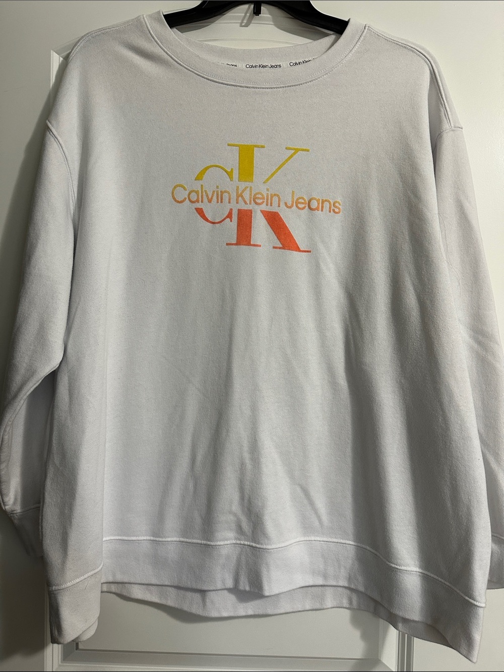 Calvin Klein Jeans White Crewneck with Yellow-to-Orange CK Logo